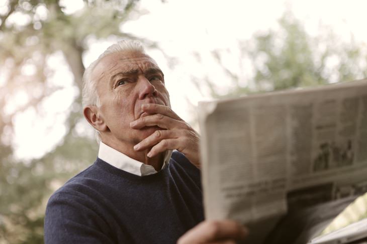 Aging Myths upset man reading newspaper