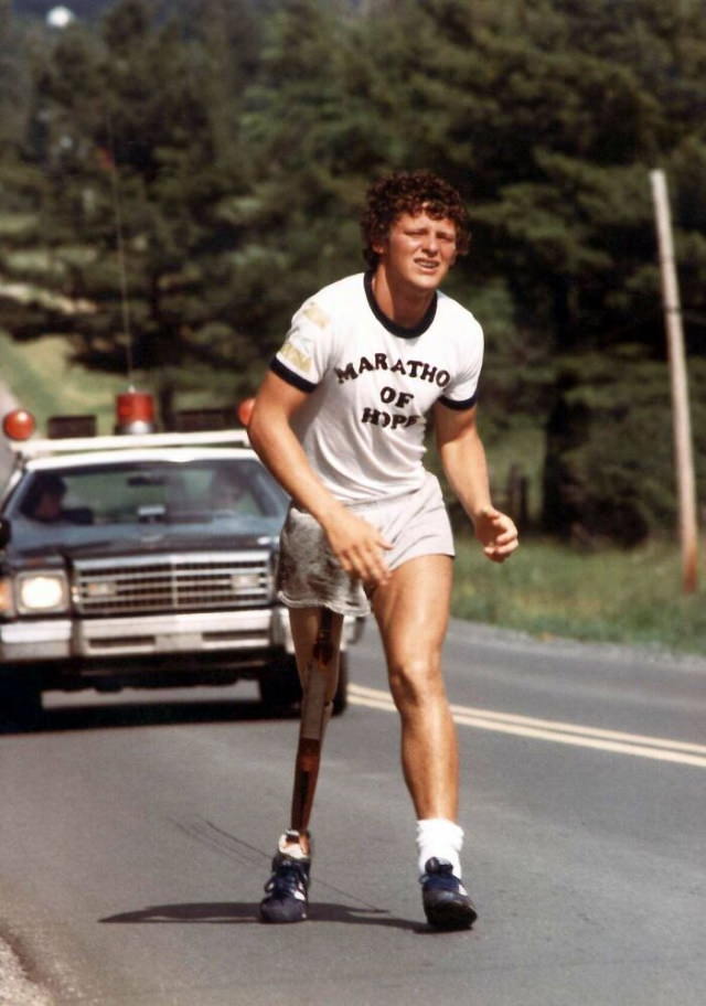 Poignant Photos A photo of Terry Fox, a 21-year-old Canadian who lost a leg to cancer during his east to west cross-Canada run. Fox raised money for cancer research and spread awareness about cancer.