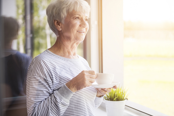 5 Practical and Easy Ways to Express Gratitude, senior woman with mug looking out the window