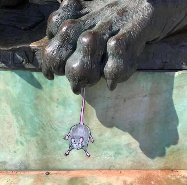 Street Artist CAL Uses Urban Corners Ingeniously, trapped mouse