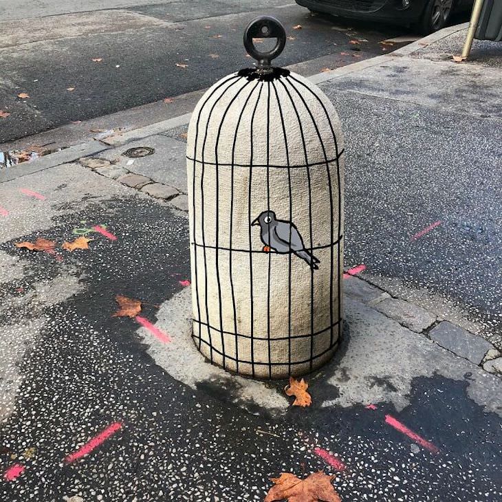 Street Artist CAL Uses Urban Corners Ingeniously, bird cage