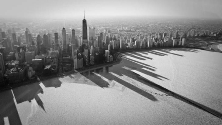 19 Images of Unusual Sights Around the World, Shadows of Chicago on frozen Lake Michigan