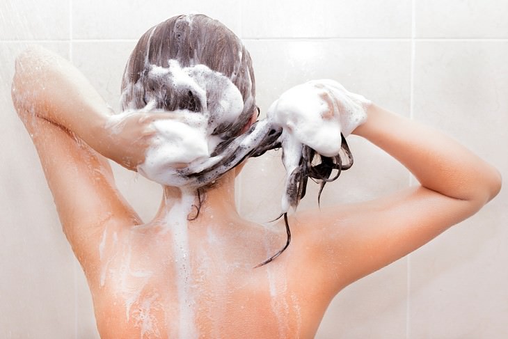 Hair Care Mistakes woman washing her hair
