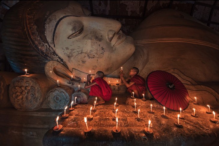 12 Unforgettable Photos of Asia by Zay Yar Lin, Novices praying to the Buddha at Nyaung Shwe Monastery
