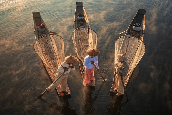 12 Unforgettable Photos of Asia by Zay Yar Lin,  Golden Nets Fishermen at Inle Lake at sunrise