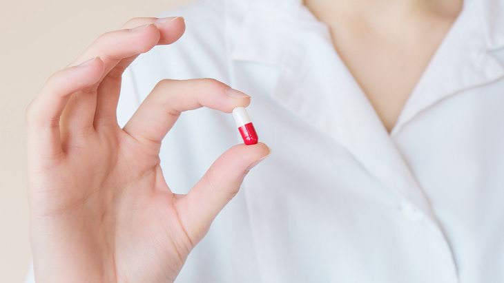 Hypertension Myths holding a pill