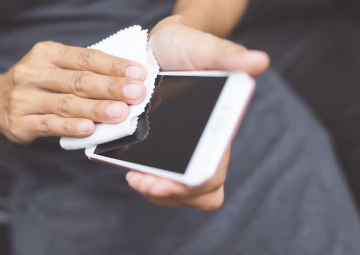 Four Ways to Salvage a Wet Phone From Experts, wiping phone with micro fiber cloth