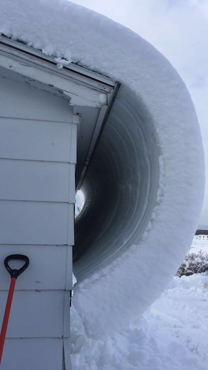 Stunning Accidental Snow Sculptures, Snow curling off a roof