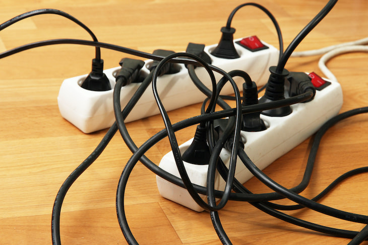 NEVER Do These 7 Things When Using a Power Strip, overloaded power strip