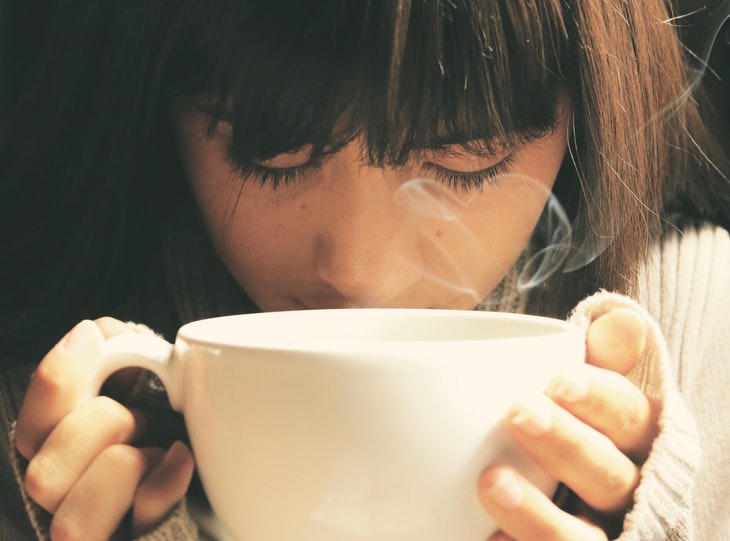 Health Benefits of Dandelion Tea woman drinking coffee