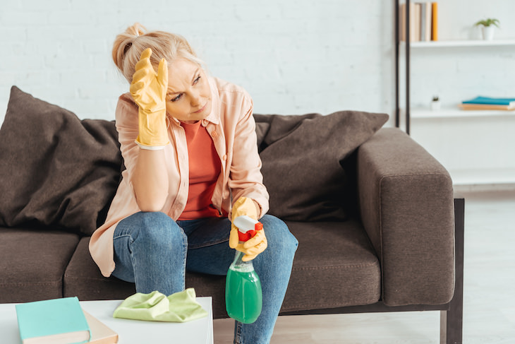 Warning Signs of Low Self Esteem, frustrated woman cleaning