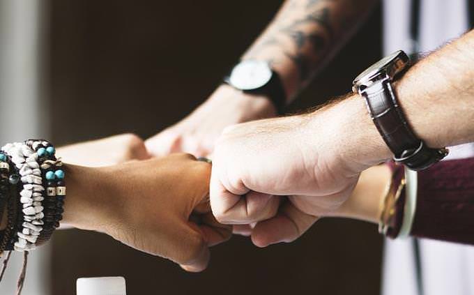 people fist bumping