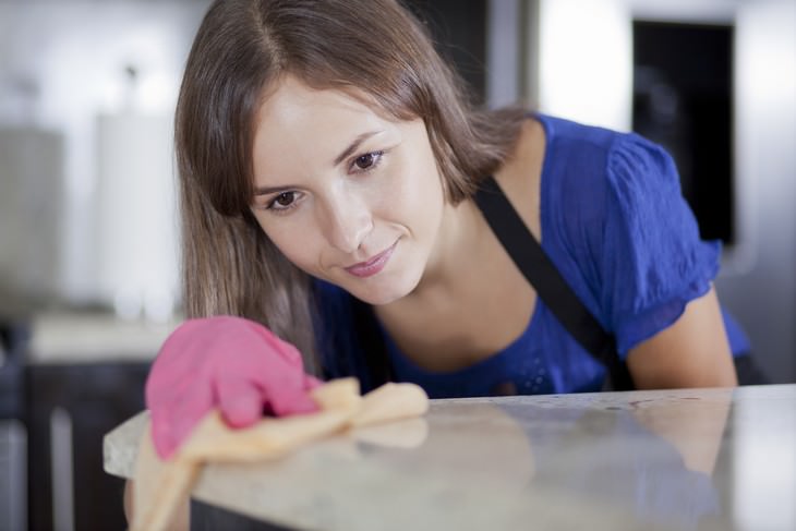 effective vintage beauty tips woman in gloves cleaning the house