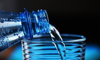 water poured from bottle to glass