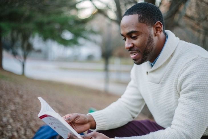 Health Benefits of Rosemary man reading a book in nature