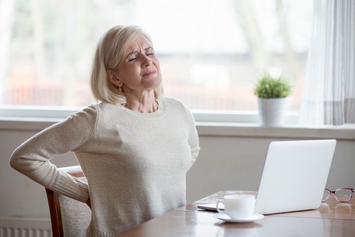 seniors health mistakes woman suffering from back pain