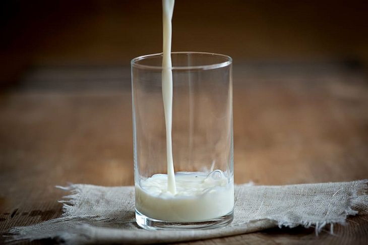 foods that cause constipation milk being poured into a glass