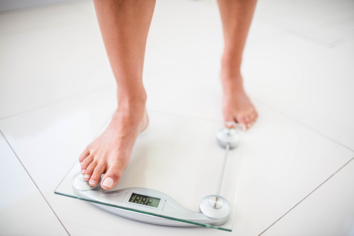 Peppermint Health Benefits woman stepping on a scale