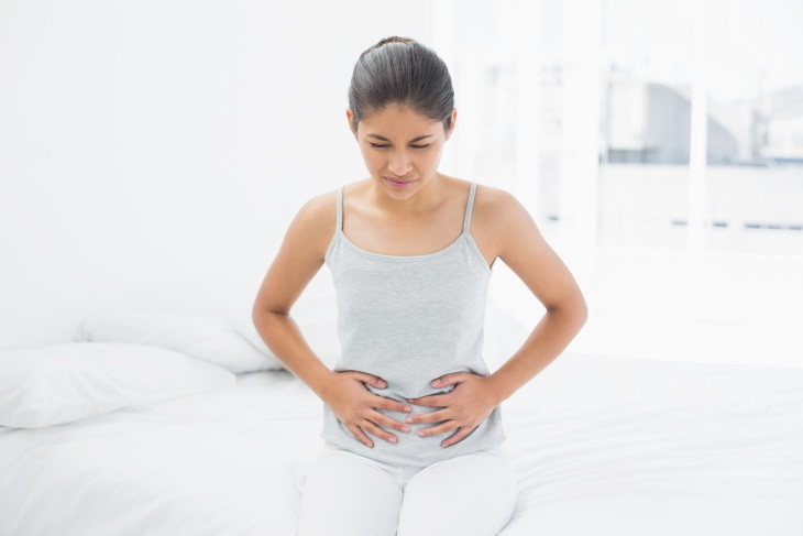 Peppermint Health Benefits woman with abdominal pain