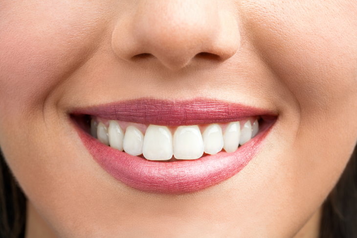 Peppermint Health Benefits a woman's smile with white teeth