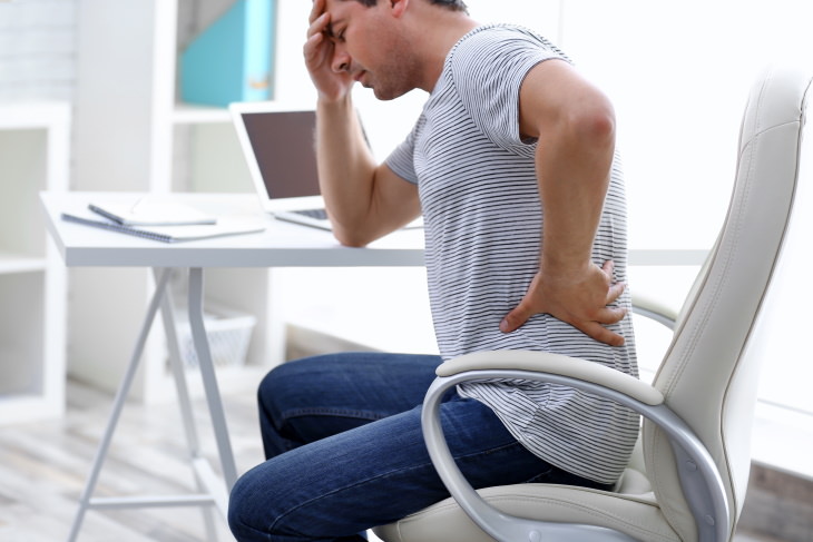 natural oil health benefits man suffering from back pain