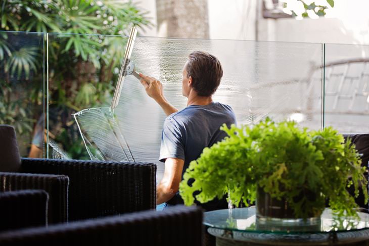 Spring Cleaning Health Benefits man cleaning balcony