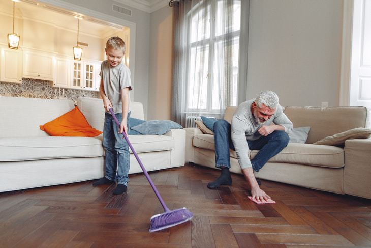 Spring Cleaning Health Benefits man and boy cleaning the floor together