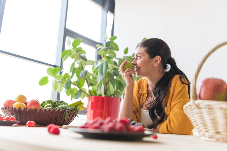 skincare tips coronavirus woman surrounded by different fruit