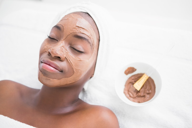 skincare tips coronavirus woman applying skin mask