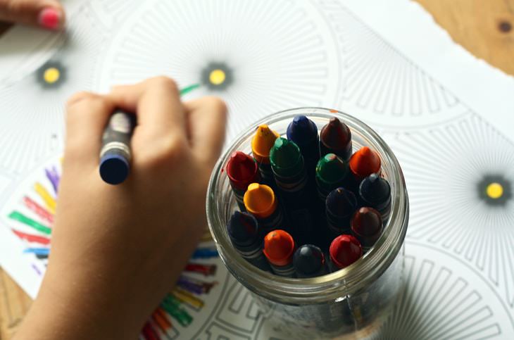 Facts About Color child coloring with crayons