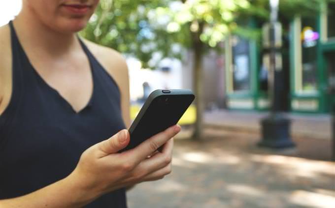 woman looking at smartphone