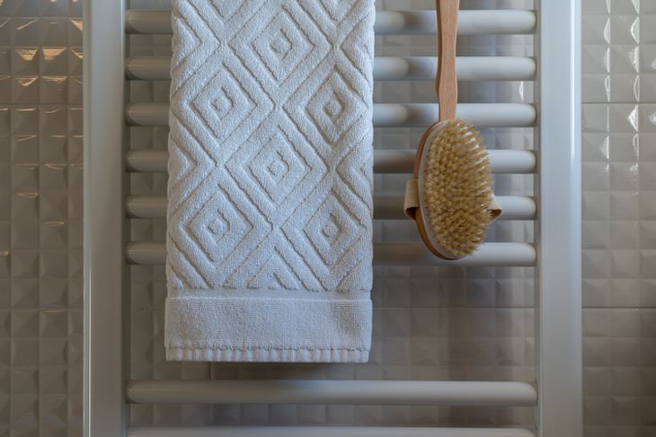 bathroom cleaning mistakes bath brush and towel