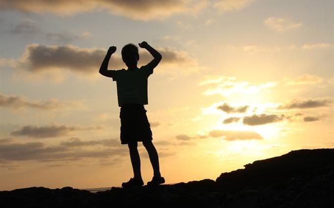 silhouette of child at sunset