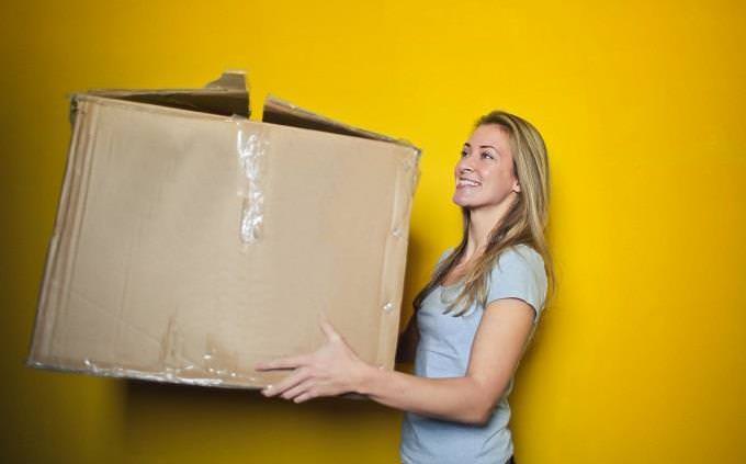 woman carrying big box