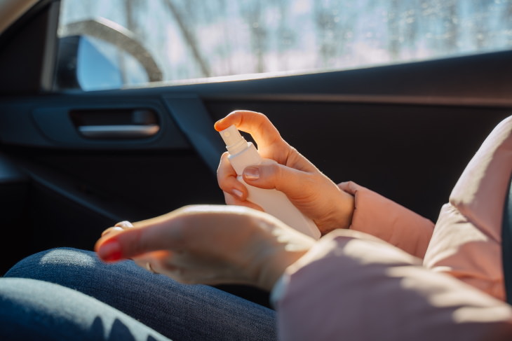 Cleaning the Car from Germs disinfecting hands