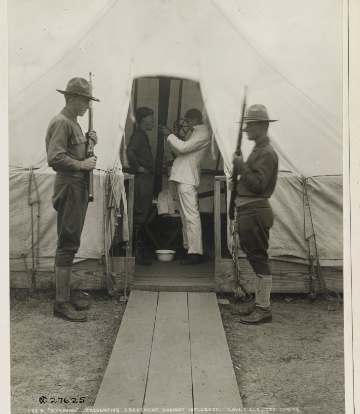 Photos From the Spanish Flu medical officers conducted an experiment by spraying a dichloramine-T on a soldier's throat