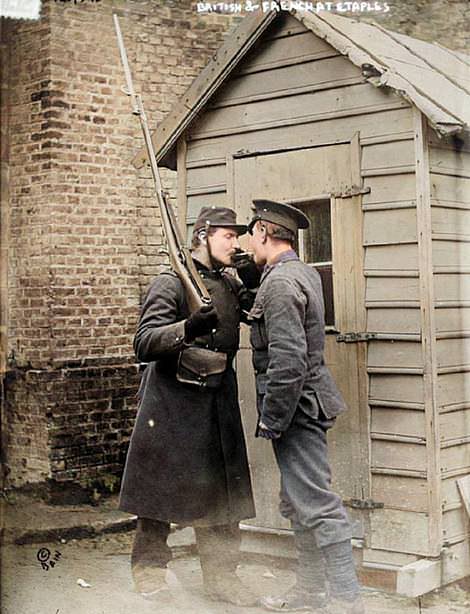 Photos From the Spanish Flu Two soldiers sharing a cigarette light near the camp and military hospital at Etaples in France