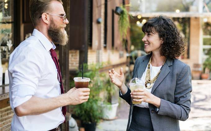 two people talking on the street man and woman