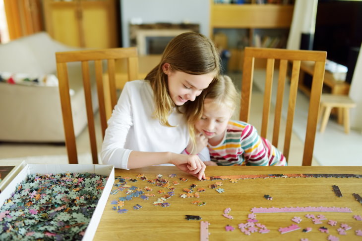 Old-Fashioned Hobbies Solving Jigsaw Puzzles