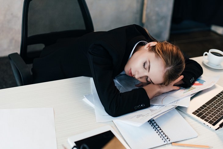 Why You Lost Your Motivation & How to Get It Back woman asleep at her desk