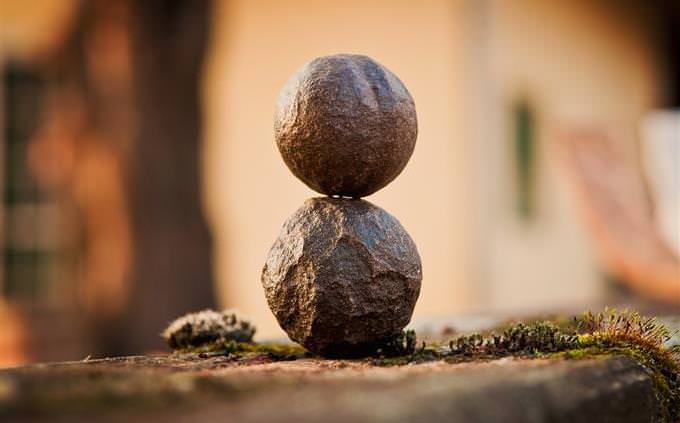 Two round rocks on top of each other