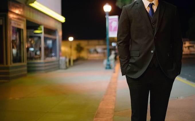 Man in suit standing in the street