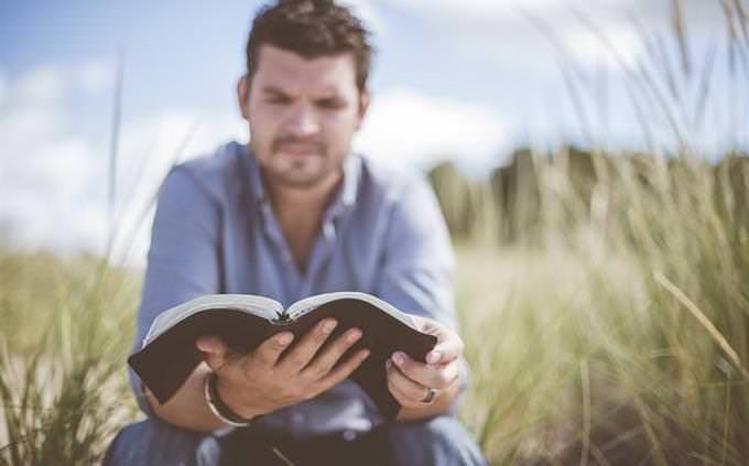 Man reading diary