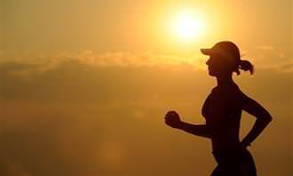 silhouette of woman running