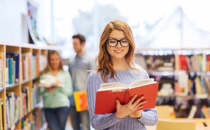 girl reading book in book store