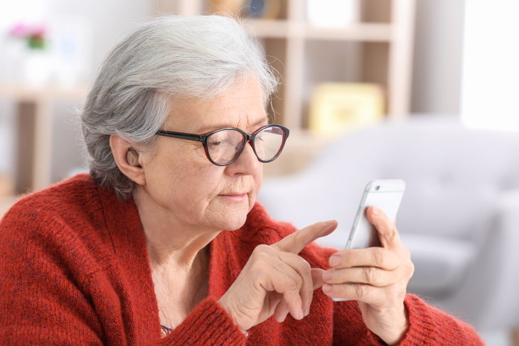 Remove Political Ads from Facebook elderly woman using iphone