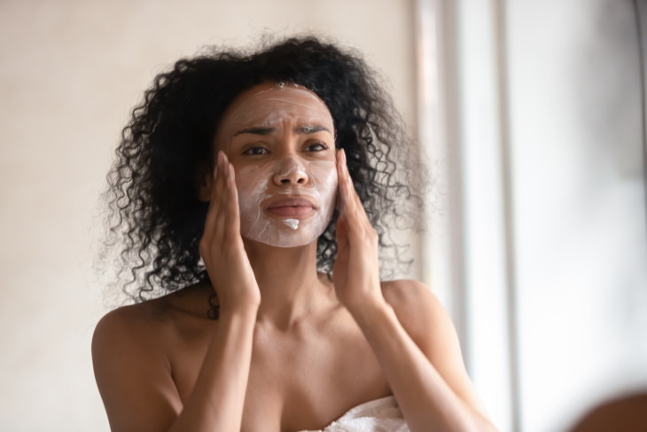 Signs of an Unhealthy Diet woman applying face mask