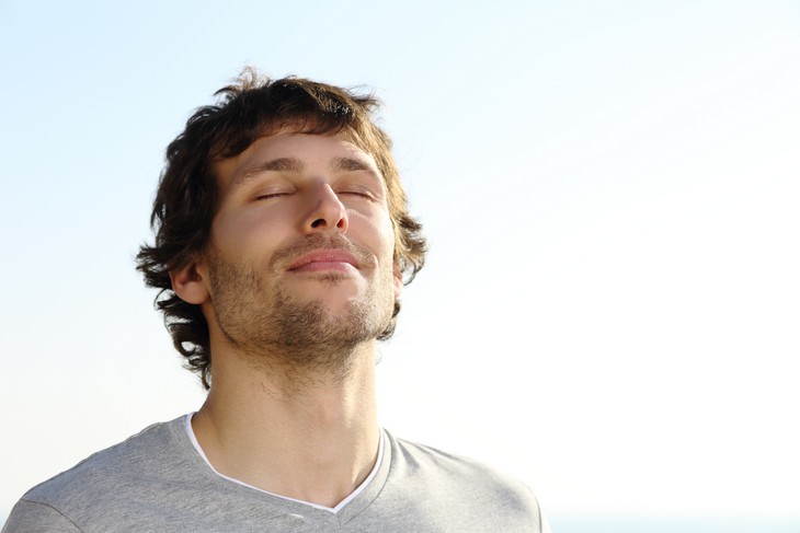 Take Control Of Your Wellbeing Through Breathing man breathing deeply