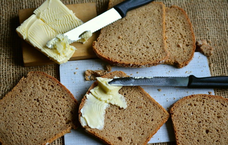 Butter vs. Margarine spreading butter and margarine on bread