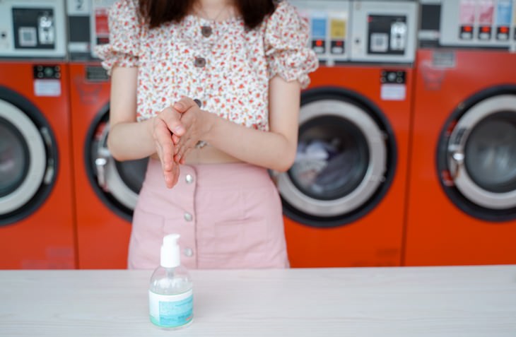 The 3 Common Hand Sanitizer Mistakes woman applying hand sanitizer